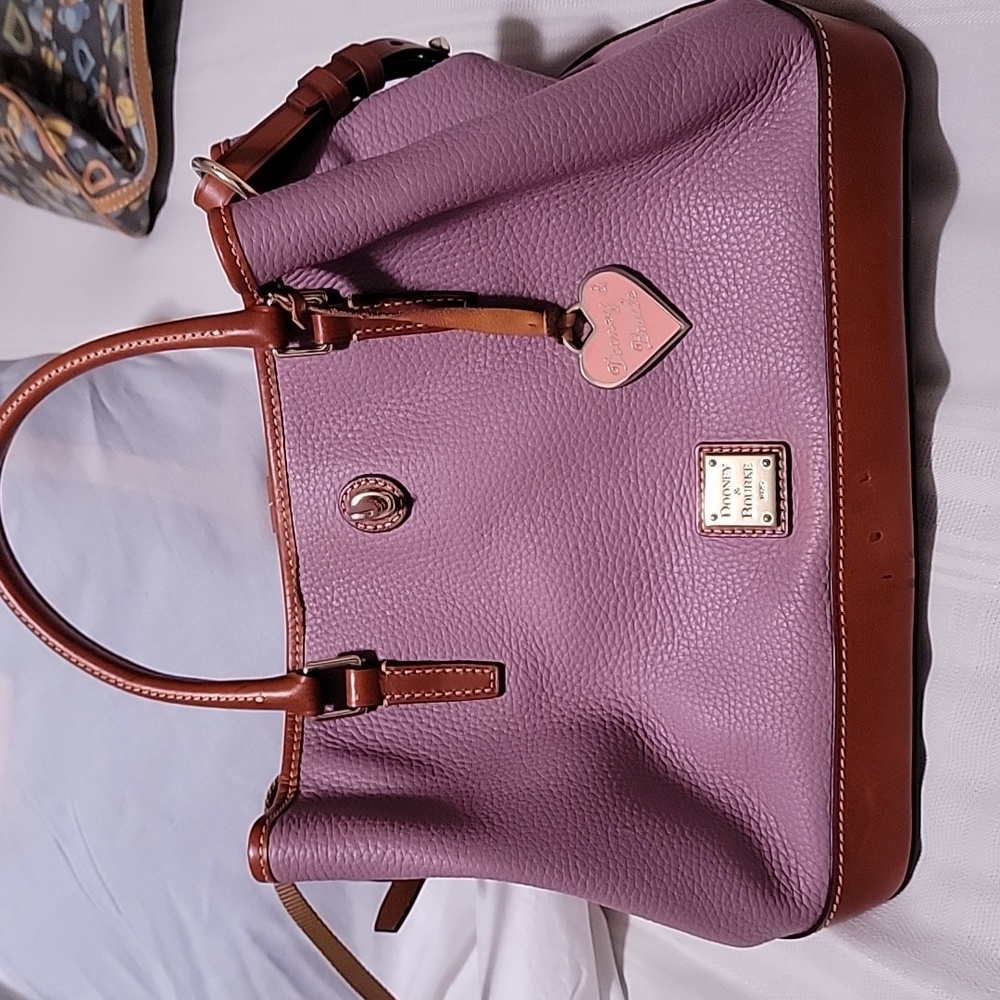 Pink and brown dooney and bourke hand bag
